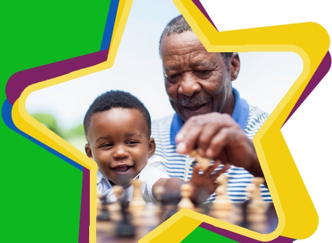 Contact Us page: Older man and young boy playing chess